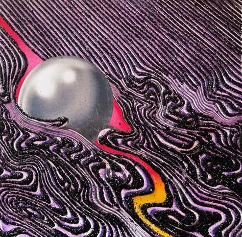 Album artwork for Tame Impala’s Currents: a silver sphere cutting through swirling purple and black lines